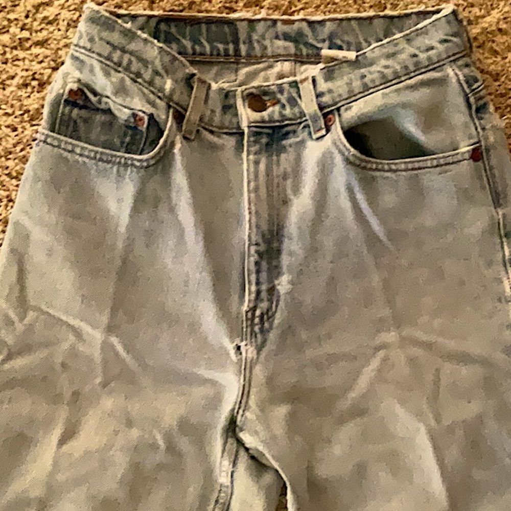 Vintage 521 Levi’s light blue jeans with wear marks